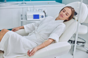 Woman in a spa-like setting enjoying IV therapy